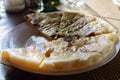 Hychin bread pie with potato stuffing. Traditional Caucasian cuisine - hot Ossetian pie