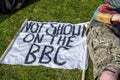 HYDE PARK, LONDON, ENGLAND- 24 April 2021: NOT SHOWN ON THE BBC banner at an anti-lockdown protest in London