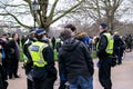 HYDE PARK, LONDON, ENGLAND- 20 March 2021: Protesters being spoken to by police at the Vigil for the Voiceless protest