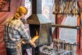 Hyde Park, London, UK 5th January, 2020. Male blacksmith working in workshop