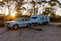 Hyden, Australia - Mar 19,2021: A large white caravan and modern 4WD vehicle in the late afternoon at the free camp at Holt Rock Royalty Free Stock Photo