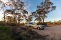 Hyden, Australia - Mar 19,2021: A large white caravan and modern 4WD vehicle in the late afternoon at the free camp at Holt Rock Royalty Free Stock Photo