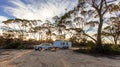 Hyden, Australia - Mar 19,2021: A large white caravan and modern 4WD vehicle in the late afternoon at the free camp at Holt Rock Royalty Free Stock Photo