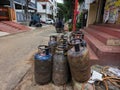 Bunch of old rusty LPG gas cylinders for kitchen cooking kept outside of the gas station or