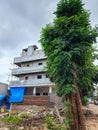 Side view of newly build apartment building in the residential area, construction work is on going. Royalty Free Stock Photo