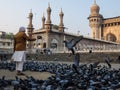 Pigeons in front of Mecca Masjid, a famous monument in Hyderabad, India.