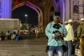 An Indian street vendor selling sunglasses outside the tourist site of Charminar in old