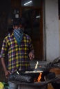 Hyderabad, Telangana, India. july-20-2020: indian young man preparing jilebi at street while wearing face mask, corona pandemic