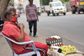 Hyderabad, Telangana, India. july-20-2020: old aged man selling eggs and lemons at road side while wearing face mask, senior man