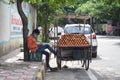 Hyderabad, Telangana, India. july-20-2020: young fruits trader selling fruits while wearing face mask, fruits at road side