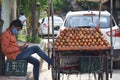 Hyderabad, Telangana, India. july-20-2020: young fruits trader selling fruits while wearing face mask, fruits at road side