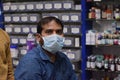 Hyderabad, Telangana, India. june-29-2020: shopkeeper running his business while wearing a mask, corona pandemic concept, medical