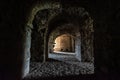 Stone arches in a tunnel corridor in the ruins of the ancient historic Golconda fort