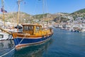 Kyra Lenia moored around Hyda waterfront with its quaint fishing boats