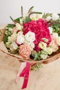 Hydrangea rich bouquet. Vintage floristic background, colorful roses, in crafting the package on the wooden table Royalty Free Stock Photo