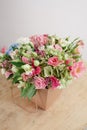 Hydrangea rich bouquet. Vintage floristic background, colorful roses, in crafting the package on the wooden table