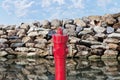Hydrant concept against a wall of rocks - Plenty of water concept Royalty Free Stock Photo
