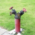 Hydrant with water hoses and fire extinguish equipment Royalty Free Stock Photo