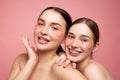 Hydrated harmony. Young girls embrace their makeup-free charm, coming together to care under-eye area with moisturized
