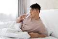 Middle aged asian man drinking water after waking up Royalty Free Stock Photo