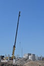Extended boom from a crane lifting an object