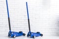 Hydraulic car floor jacks. Car Lift. Blue Hydraulic Floor Jack For car Repairing. Extra safety measures. Car service station