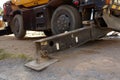 Hydraulics crane support. hydraulics crane support is on the ground. Hydraulic foot of the crane.