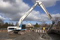 Hydraulic crawler crane digs Royalty Free Stock Photo