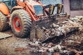 crusher, industrial excavator machinery working on construction site demolition