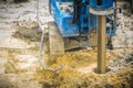 Hydraulic drilling machine is boring holes in the construction site for bored piles work. Bored piles are reinforced concrete elem