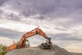 Hydraulic excavator climbed on a ballast pile Royalty Free Stock Photo