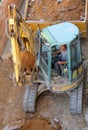 Hydraulic excavator doing earthmoving work