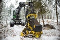 Hydraulic excavator in forest. Winter snow. Royalty Free Stock Photo