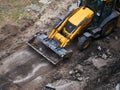 Hydraulic Excavator Removing Remains of asphalt. Road reconstruction. Pavement repair