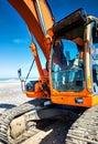 hydraulic excavators and driver working close-up Royalty Free Stock Photo