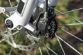 Hydraulic front disc brake on mountain bike with bicycle hub, caliper and spokes. Royalty Free Stock Photo