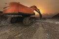 Hydraulic hammer drilling rock on road construction works Royalty Free Stock Photo