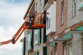 Hydraulic lift platform of the bucket cabin of a telescopic elevator on working construction site Royalty Free Stock Photo