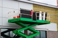 Hydraulic lift platform of the bucket cabin of a telescopic elevator on working construction site Royalty Free Stock Photo