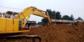 hydraulic machine digging soil for road construction work in India aug 2019