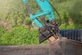 Hydraulic part of a large excavator close-up. The subject of repair and maintenance of heavy construction large-sized Royalty Free Stock Photo