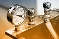 Hydraulic pressure gauges, manometers and water taps. Brown toned