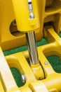 Hydraulics system yellow tractor Royalty Free Stock Photo