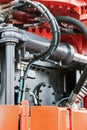 Hydraulics tractor red. focus on the hydraulic pipes Royalty Free Stock Photo