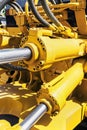 Hydraulics tractor yellow Royalty Free Stock Photo