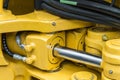 Hydraulics tractor yellow Royalty Free Stock Photo