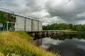 Hydro electric power plant with dark overcast sky Royalty Free Stock Photo