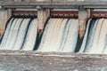 Hydroelectric power station. Flowing water through gate or floodgate Royalty Free Stock Photo