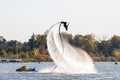 Hydroflight sportsman turning somersault on flyboard at South Russian Aquabike Championship