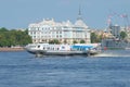 The hydrofoil against the building of the Nakhimov naval school sunny day in July. St. Petersburg, Russia